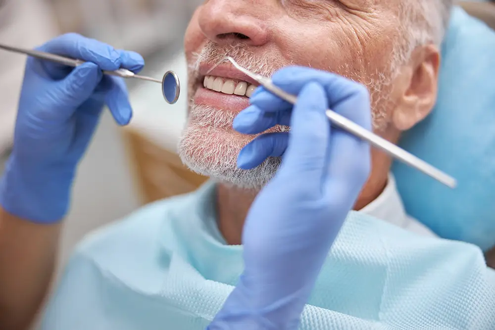 man receiving dental exam