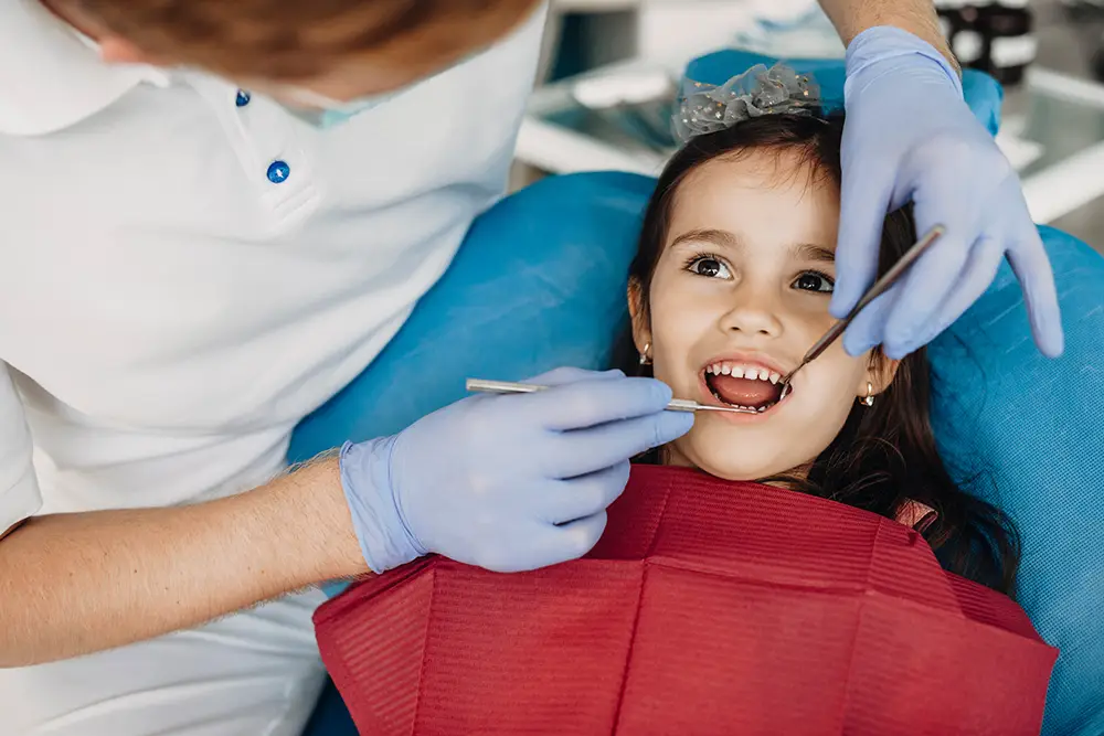 child receiving dental exam